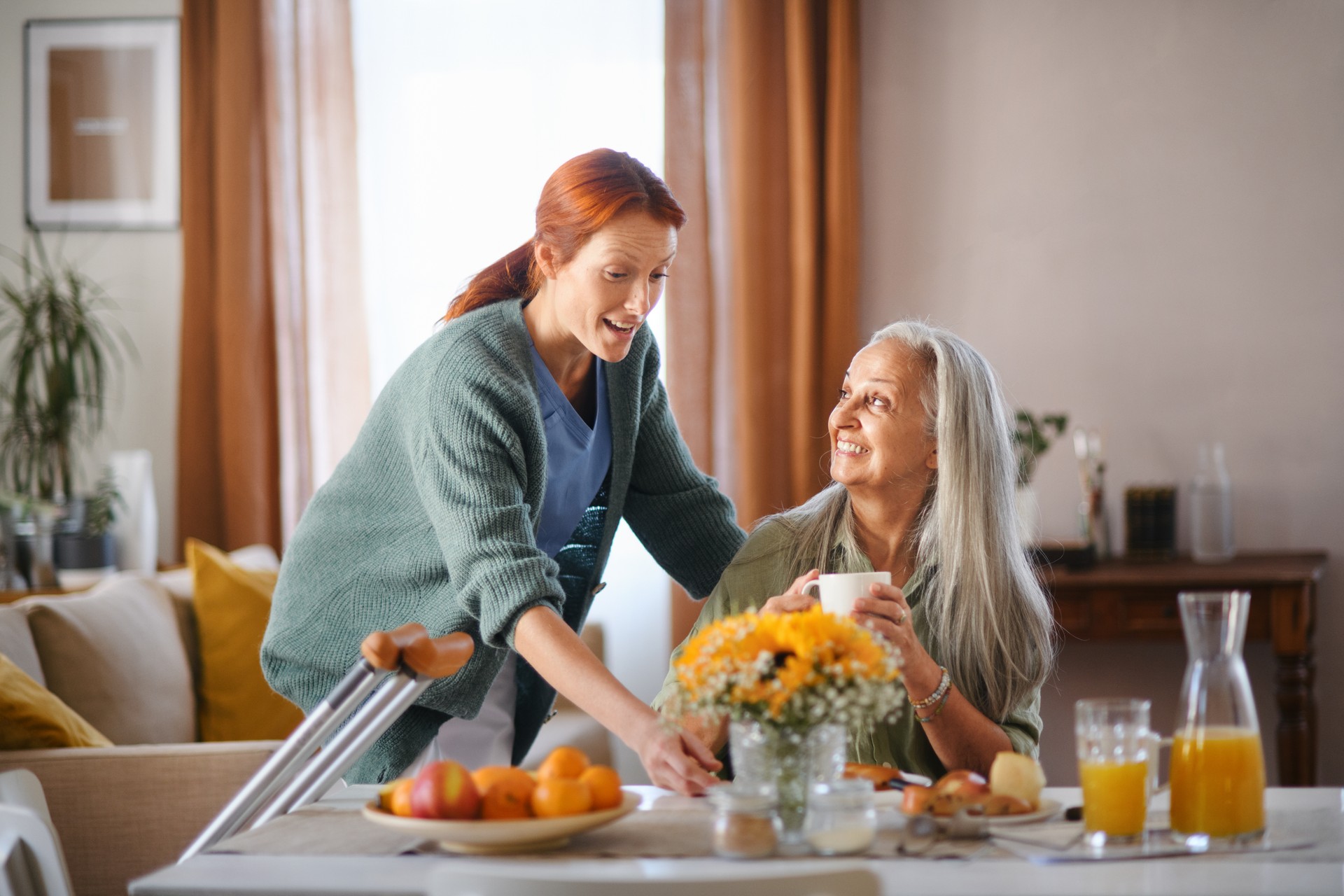 Cregiver prepared breakfast for her senior client.